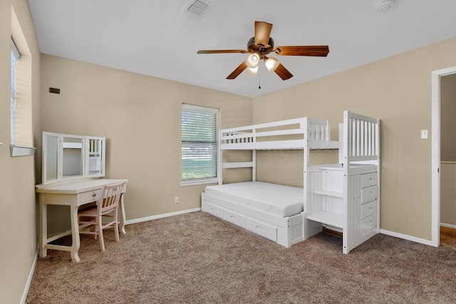 unfurnished bedroom with ceiling fan and carpet flooring