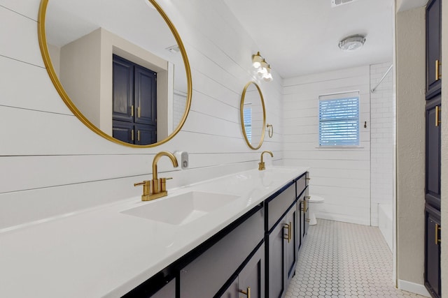 full bathroom featuring toilet, vanity, bathing tub / shower combination, and wood walls