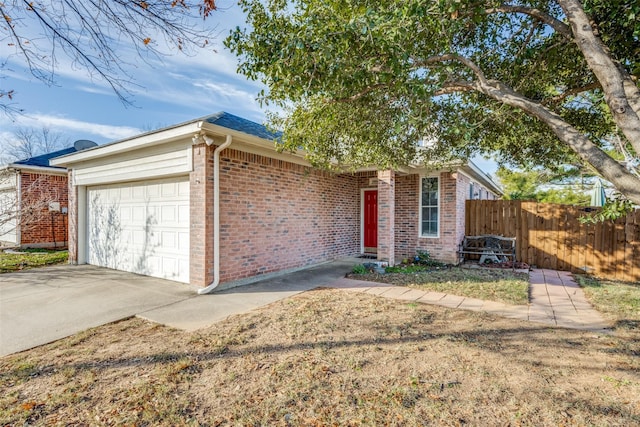 ranch-style home featuring a garage