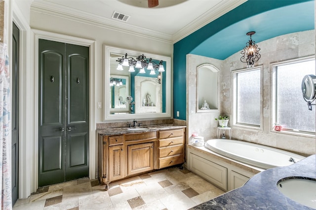 bathroom with a tub to relax in, vanity, and ornamental molding