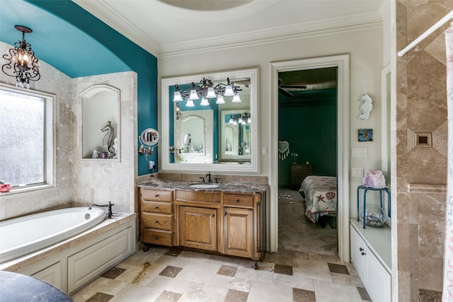 bathroom featuring a bathing tub, ornamental molding, a chandelier, and vanity