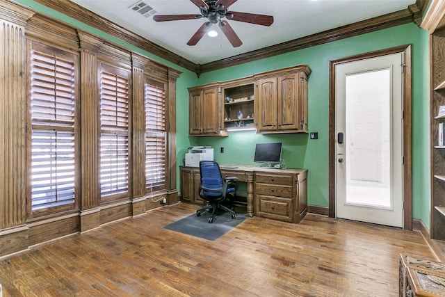 home office featuring ceiling fan, dark hardwood / wood-style floors, and ornamental molding