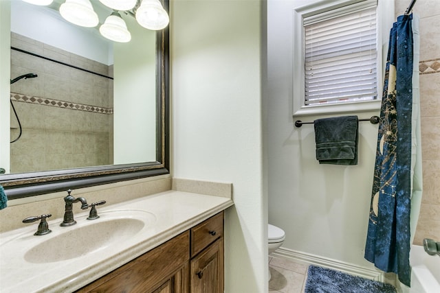 full bathroom featuring toilet, vanity, tile patterned floors, and shower / bath combo with shower curtain