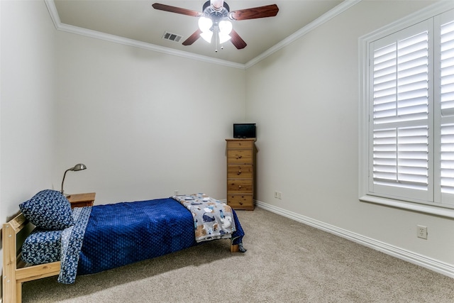 bedroom featuring ceiling fan, multiple windows, carpet, and crown molding