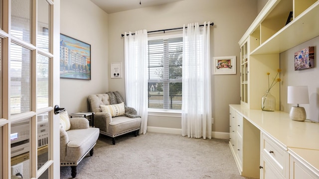 living area with light colored carpet