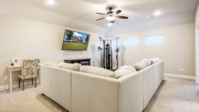 living room featuring ceiling fan and light colored carpet