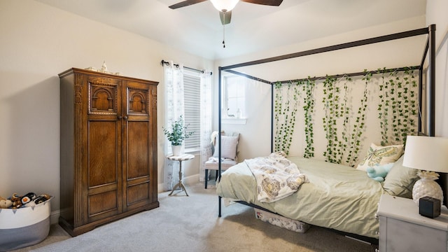 bedroom featuring ceiling fan and light carpet