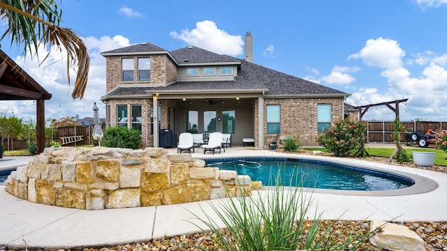 view of pool with ceiling fan, a pergola, and a patio