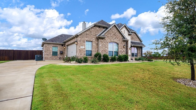 view of front of home featuring a front lawn, central AC, and a garage