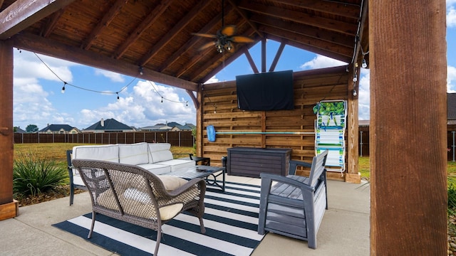 view of patio with ceiling fan, outdoor lounge area, and a gazebo