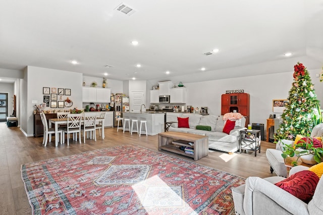 living room with light hardwood / wood-style floors