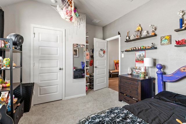 bedroom featuring light carpet