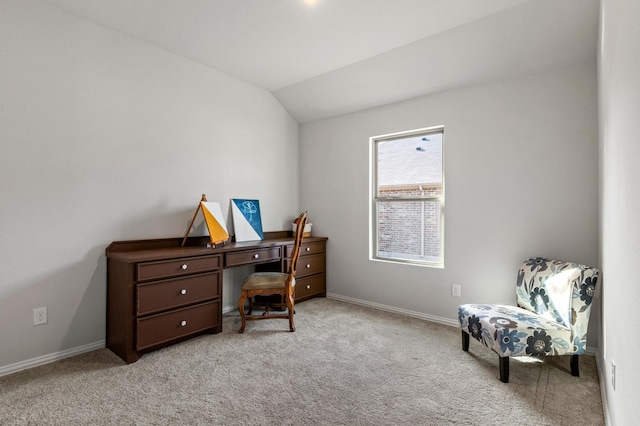 carpeted office with vaulted ceiling