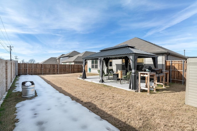 back of house with a patio area and a gazebo