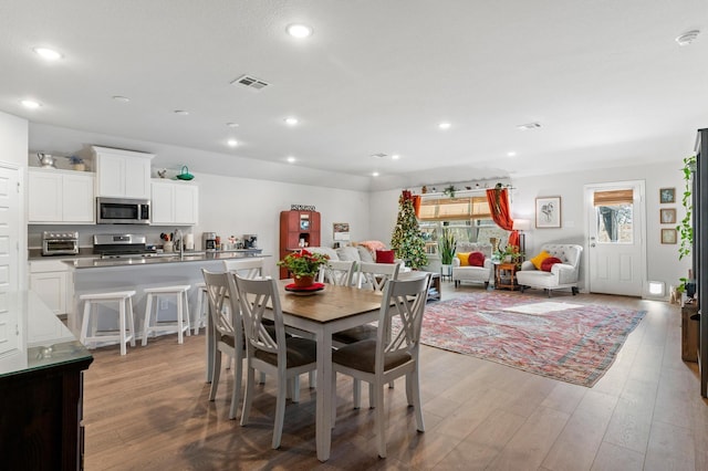 dining area with light hardwood / wood-style floors