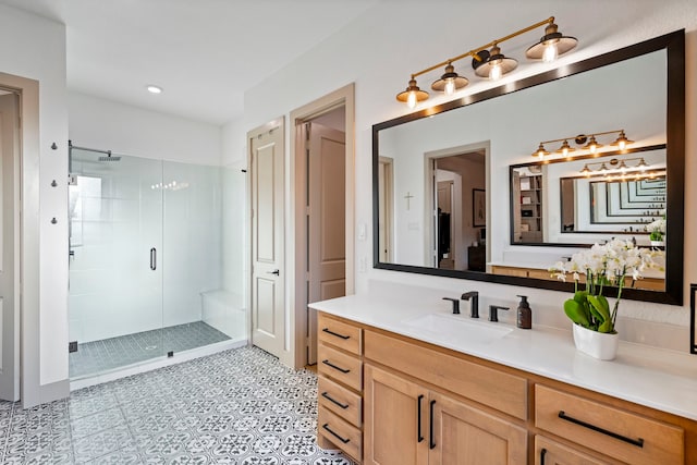 bathroom featuring vanity and an enclosed shower