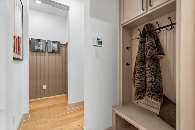 mudroom with light hardwood / wood-style flooring