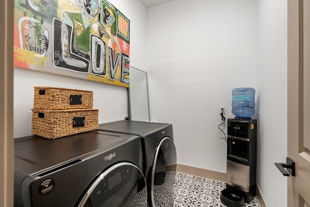 clothes washing area featuring washer and dryer