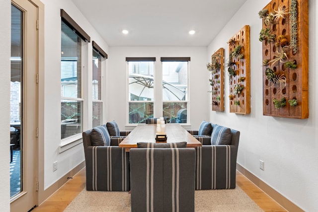 dining area featuring light wood-type flooring and a wealth of natural light