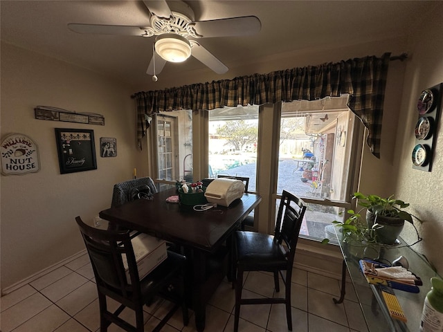 tiled dining room with ceiling fan