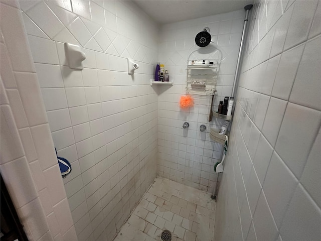 bathroom with a tile shower