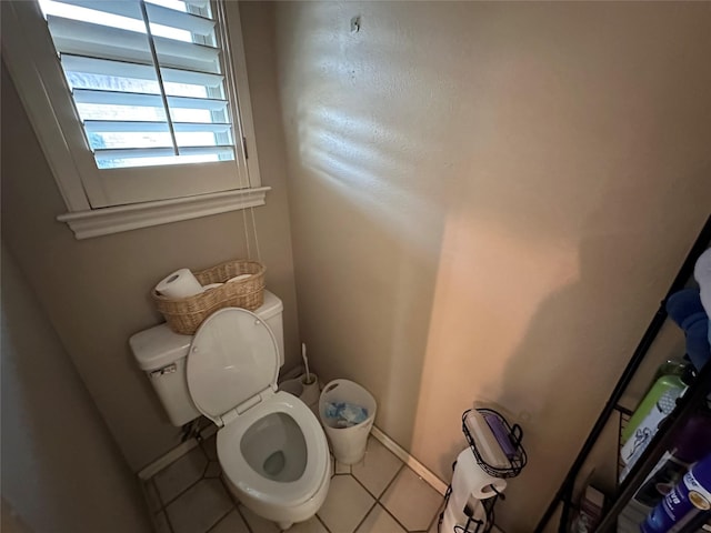 bathroom featuring toilet and tile patterned floors