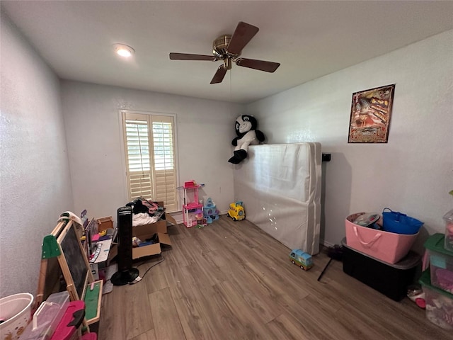 game room featuring ceiling fan and hardwood / wood-style floors