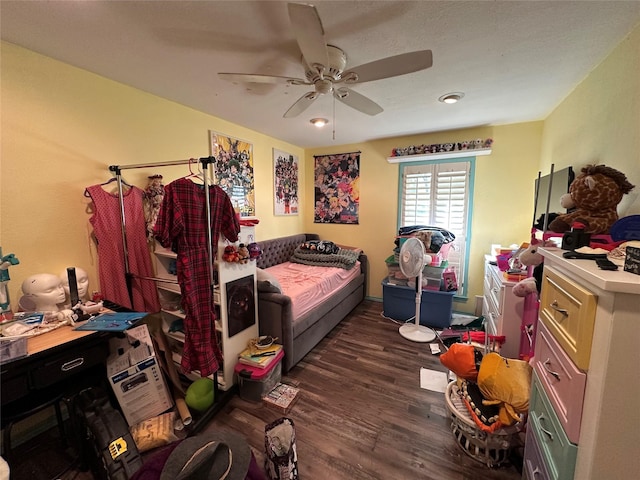 bedroom featuring ceiling fan and dark hardwood / wood-style floors