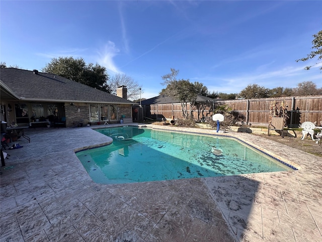 view of swimming pool with a patio area