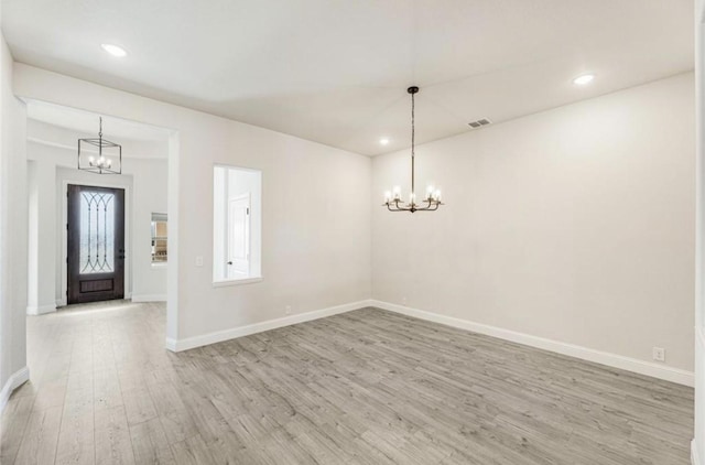 entryway with light wood-style flooring, a chandelier, baseboards, and recessed lighting