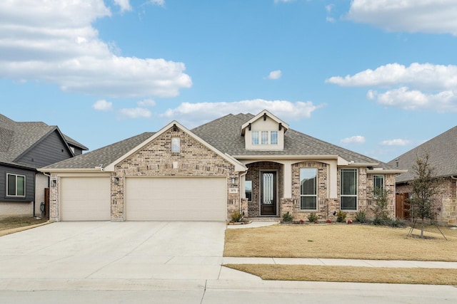 view of front facade with a front yard and a garage