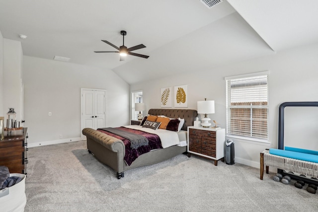 bedroom featuring vaulted ceiling, ceiling fan, and light colored carpet