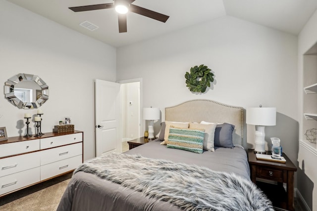 bedroom featuring visible vents, vaulted ceiling, carpet flooring, and ceiling fan