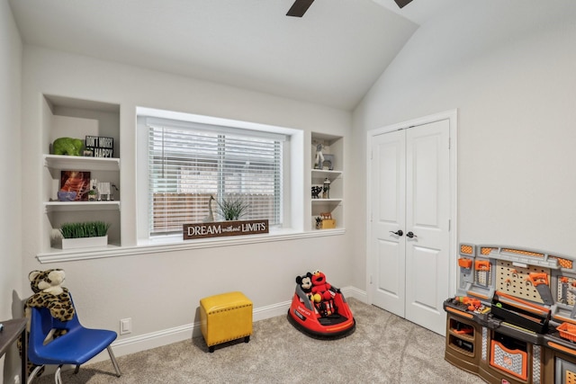 rec room featuring carpet floors, lofted ceiling, baseboards, and built in shelves