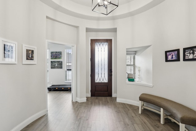 entrance foyer featuring a chandelier and light hardwood / wood-style flooring