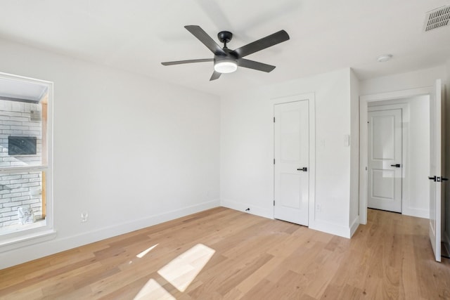 unfurnished bedroom with ceiling fan and light hardwood / wood-style flooring