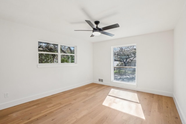 spare room with ceiling fan and light hardwood / wood-style flooring