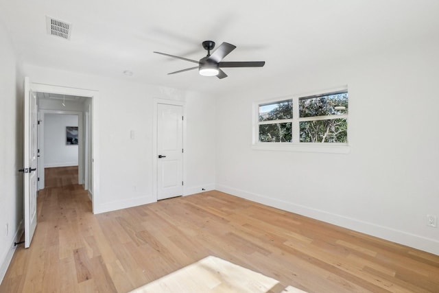 unfurnished bedroom with ceiling fan, light hardwood / wood-style flooring, and a closet