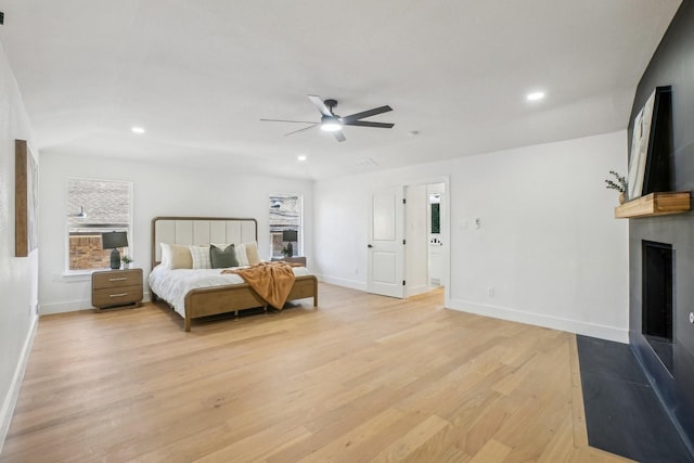 bedroom with ceiling fan and light hardwood / wood-style floors