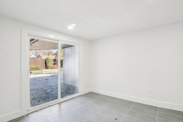 empty room with tile patterned flooring