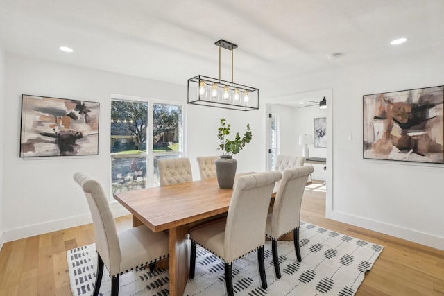 dining area featuring ceiling fan and light hardwood / wood-style flooring