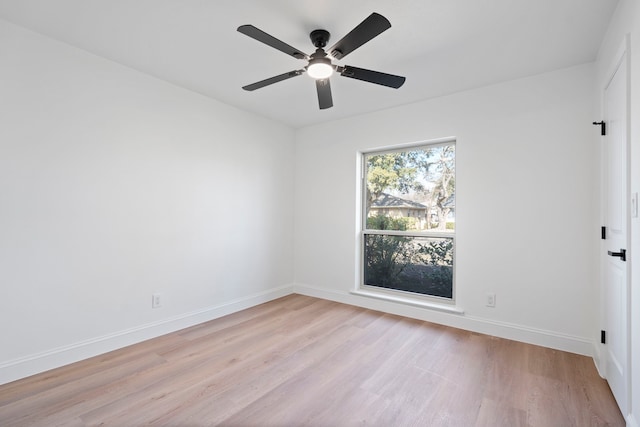 spare room featuring ceiling fan and light wood-type flooring