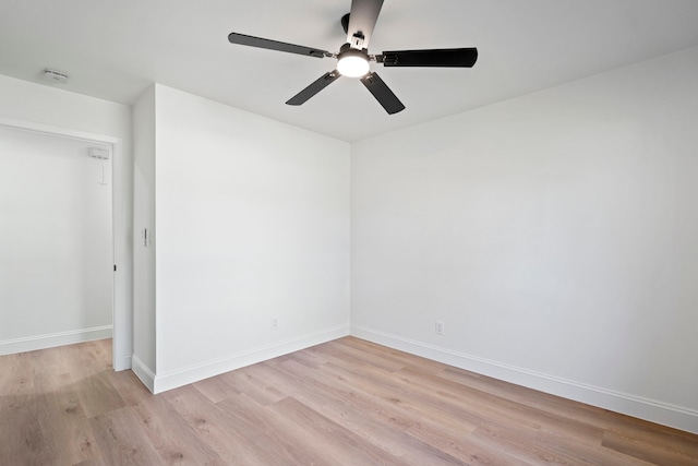 unfurnished room with ceiling fan and light wood-type flooring