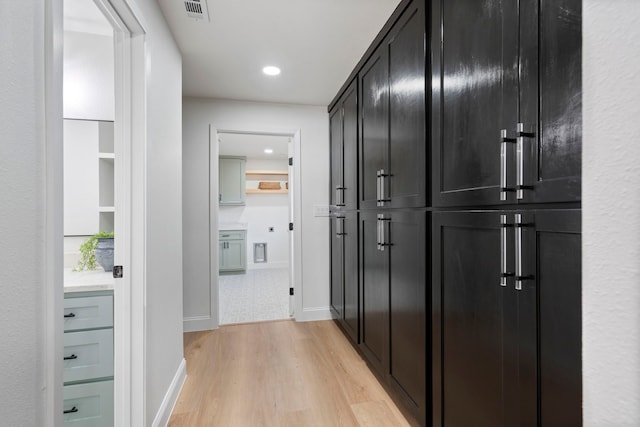 hallway with light wood-type flooring