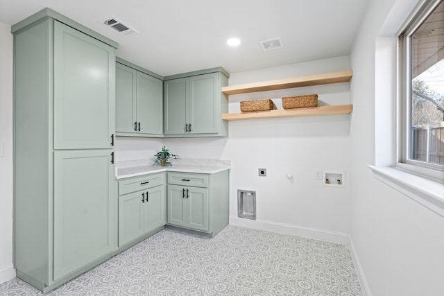 laundry room with hookup for a washing machine, hookup for a gas dryer, cabinets, and hookup for an electric dryer