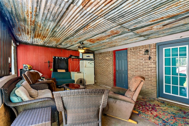 interior space with ceiling fan and an outdoor hangout area