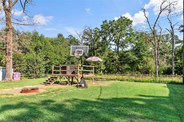 view of yard with a fire pit