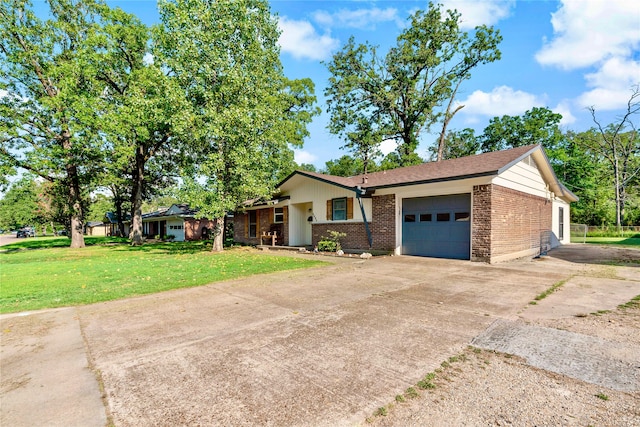 single story home with a garage and a front lawn