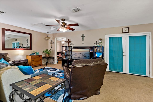 carpeted living room featuring ceiling fan