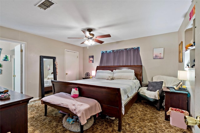 carpeted bedroom with ceiling fan